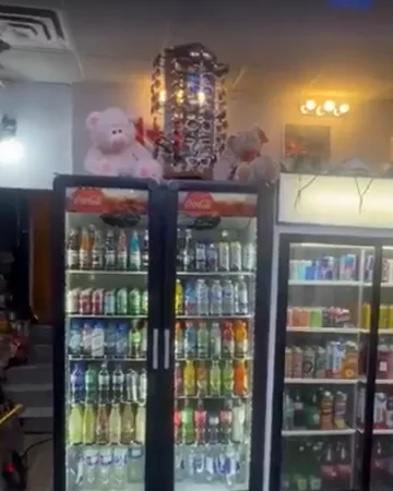 Lit drinks coolers along the back wall